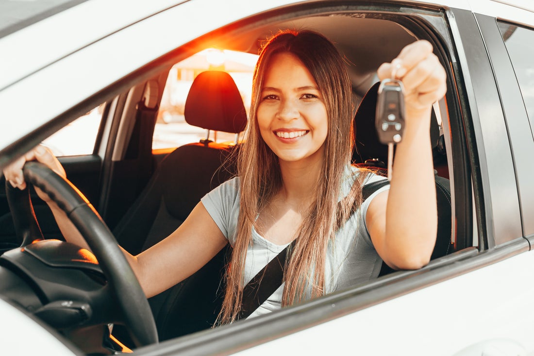 a woman sitting in a car