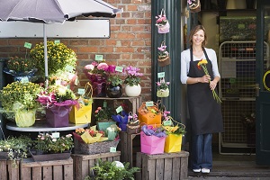 woman standing outside flower business